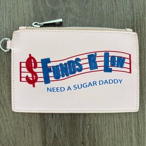 Sugar Thrillz "Funds R Low" wristlet clutch is a pink vegan leather wallet